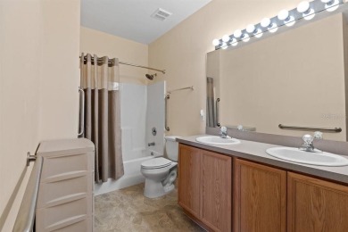 Welcome to this charming three-bedroom, two-bathroom home with a on Deep Creek Golf Club in Florida - for sale on GolfHomes.com, golf home, golf lot