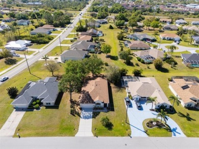 Welcome to this charming three-bedroom, two-bathroom home with a on Deep Creek Golf Club in Florida - for sale on GolfHomes.com, golf home, golf lot