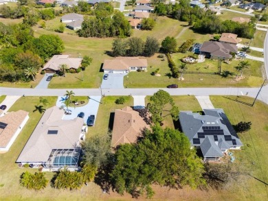 Welcome to this charming three-bedroom, two-bathroom home with a on Deep Creek Golf Club in Florida - for sale on GolfHomes.com, golf home, golf lot