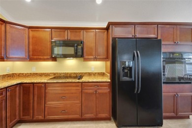 Highly desirable Block/Stucco 3/2 with 2 car + golf cart garage on The Links of Spruce Creek in Florida - for sale on GolfHomes.com, golf home, golf lot