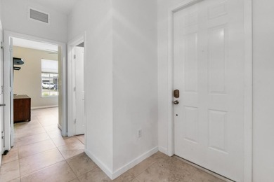 Beautifully maintained END-UNIT townhouse in a GATED community on Heritage Ridge Golf Club in Florida - for sale on GolfHomes.com, golf home, golf lot