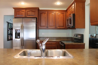 Welcome to this beautifully maintained Eden home with 1598 sq ft on Mainlands Golf Club in Florida - for sale on GolfHomes.com, golf home, golf lot