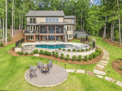 OUTSTANDING PANORAMIC VIEWS - 6BR/6.5BA LAKEFRONT HOME IN on Great Waters Course At Reynolds Plantation in Georgia - for sale on GolfHomes.com, golf home, golf lot