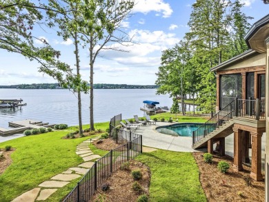 OUTSTANDING PANORAMIC VIEWS - 6BR/6.5BA LAKEFRONT HOME IN on Great Waters Course At Reynolds Plantation in Georgia - for sale on GolfHomes.com, golf home, golf lot