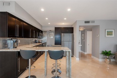 GREAT TURN KEY UNIT WITH GOLF VIEW, ENJOY LOOKING AT TOP GOLFERS on The Diplomat Golf Resort and Spa in Florida - for sale on GolfHomes.com, golf home, golf lot