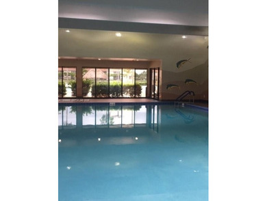 CHARMING 2BR 1.5 BA APARTMENT WITH RELAXING POOL & GARDEN VIEW on Flamingo Lakes Country Club in Florida - for sale on GolfHomes.com, golf home, golf lot