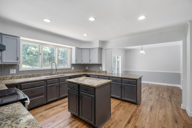 Stunning 4-bedroom, 3-bathroom brick residence situated on a on Woodside Plantation Country Club in South Carolina - for sale on GolfHomes.com, golf home, golf lot