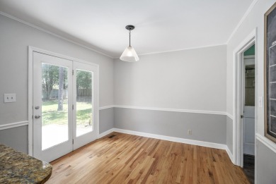 Stunning 4-bedroom, 3-bathroom brick residence situated on a on Woodside Plantation Country Club in South Carolina - for sale on GolfHomes.com, golf home, golf lot