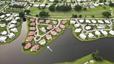 WATERFRONT GEM! Discover one of the largest villas in the highly on Atlantis Golf Club in Florida - for sale on GolfHomes.com, golf home, golf lot