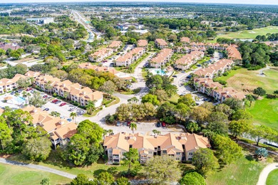 First-floor golf villa located in the heart of PGA Village on PGA Golf Club in PGA Village in Florida - for sale on GolfHomes.com, golf home, golf lot