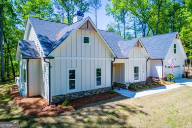 Welcome home! This less than one year old modern farmhouse on Fairfield Plantation Golf and Country Club in Georgia - for sale on GolfHomes.com, golf home, golf lot