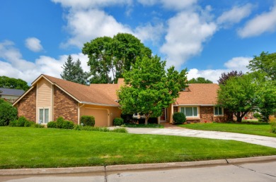 Set on a beautifully landscaped half-acre lot, this spacious on Urbandale Golf and Country Club in Iowa - for sale on GolfHomes.com, golf home, golf lot
