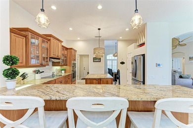 Nestled within a private oasis overlooking a tranquil preserve on River Wilderness Golf and Country Club in Florida - for sale on GolfHomes.com, golf home, golf lot