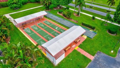 Beautiful1bedroom with 1.5 bath in an Executive Country Club & on Poinciana Golf Club in Florida - for sale on GolfHomes.com, golf home, golf lot