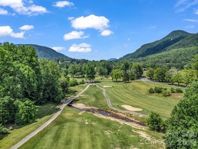 Exceptional location with stunning views of the dramatic on Rumbling Bald Resort on Lake Lure in North Carolina - for sale on GolfHomes.com, golf home, golf lot