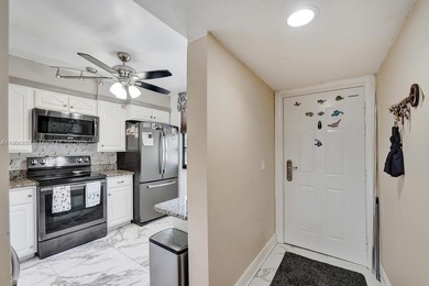 This 2 bedroom 2 bath Whitehall 1 condo features 1,385 sq ft of on Pine Island Ridge Country Club in Florida - for sale on GolfHomes.com, golf home, golf lot