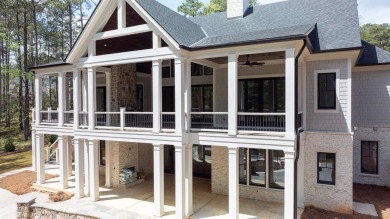 Indulge in opulent living within this custom 5-bedroom, 5.5-bath on Reynolds Lake Oconee - The Oconee in Georgia - for sale on GolfHomes.com, golf home, golf lot