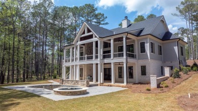 Indulge in opulent living within this custom 5-bedroom, 5.5-bath on Reynolds Lake Oconee - The Oconee in Georgia - for sale on GolfHomes.com, golf home, golf lot