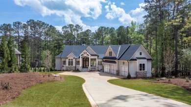 Indulge in opulent living within this custom 5-bedroom, 5.5-bath on Reynolds Lake Oconee - The Oconee in Georgia - for sale on GolfHomes.com, golf home, golf lot