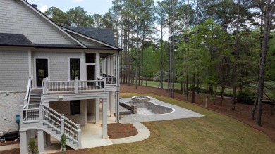 Indulge in opulent living within this custom 5-bedroom, 5.5-bath on Reynolds Lake Oconee - The Oconee in Georgia - for sale on GolfHomes.com, golf home, golf lot