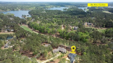 Indulge in opulent living within this custom 5-bedroom, 5.5-bath on Reynolds Lake Oconee - The Oconee in Georgia - for sale on GolfHomes.com, golf home, golf lot