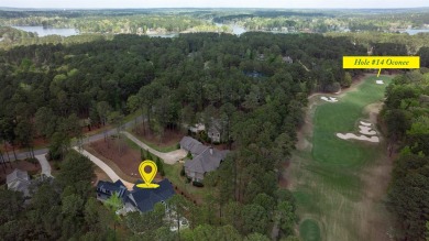 Indulge in opulent living within this custom 5-bedroom, 5.5-bath on Reynolds Lake Oconee - The Oconee in Georgia - for sale on GolfHomes.com, golf home, golf lot