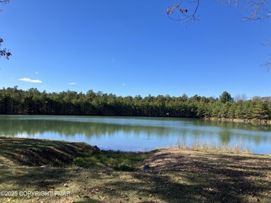 Seller has aggressively priced to sell this stunning on Pinecrest Lake Golf and Country Club in Pennsylvania - for sale on GolfHomes.com, golf home, golf lot