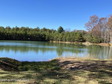 Seller has aggressively priced to sell this stunning on Pinecrest Lake Golf and Country Club in Pennsylvania - for sale on GolfHomes.com, golf home, golf lot