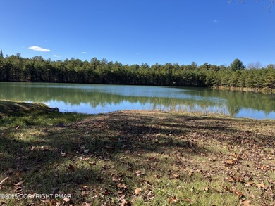 Seller has aggressively priced to sell this stunning on Pinecrest Lake Golf and Country Club in Pennsylvania - for sale on GolfHomes.com, golf home, golf lot