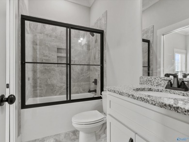 Overlooking Hole #5 of Canebrake Golf Course, this thoughtfully on Canebrake Golf Club in AL - for sale on GolfHomes.com, golf home, golf lot