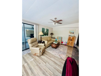 This well-maintained two-bedroom, two-bathroom residence offers on Pine Lakes Country Club in Florida - for sale on GolfHomes.com, golf home, golf lot