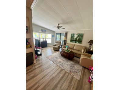 This well-maintained two-bedroom, two-bathroom residence offers on Pine Lakes Country Club in Florida - for sale on GolfHomes.com, golf home, golf lot