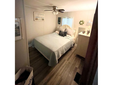 This well-maintained two-bedroom, two-bathroom residence offers on Pine Lakes Country Club in Florida - for sale on GolfHomes.com, golf home, golf lot
