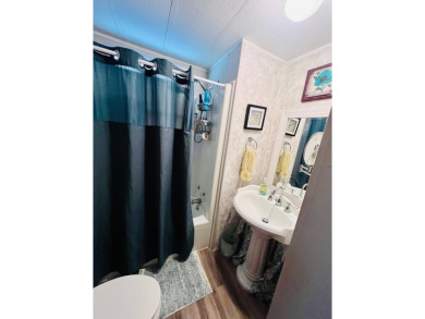 This well-maintained two-bedroom, two-bathroom residence offers on Pine Lakes Country Club in Florida - for sale on GolfHomes.com, golf home, golf lot