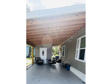 This well-maintained two-bedroom, two-bathroom residence offers on Pine Lakes Country Club in Florida - for sale on GolfHomes.com, golf home, golf lot