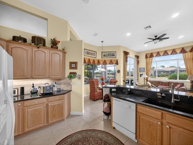 Beautifully designed and ideally situated on the lake, this on PGA Golf Club in PGA Village in Florida - for sale on GolfHomes.com, golf home, golf lot