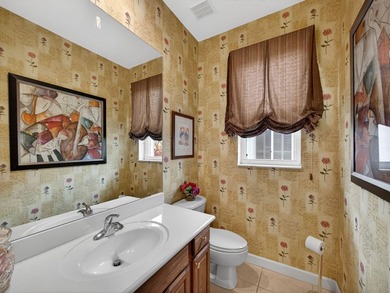 Beautifully designed and ideally situated on the lake, this on PGA Golf Club in PGA Village in Florida - for sale on GolfHomes.com, golf home, golf lot