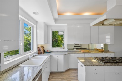 OVERSIZED WATERFRONT HOME WITH 80FT OF WATERFRONTAGE & GOLF on Miami Beach Golf Club in Florida - for sale on GolfHomes.com, golf home, golf lot