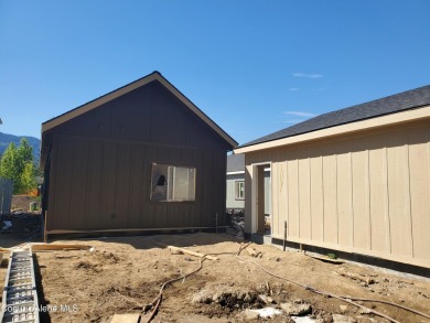 Charming 2-bedroom, 2-bath cottage nestled in a peaceful on Sandpoint Elks Golf Course in Idaho - for sale on GolfHomes.com, golf home, golf lot