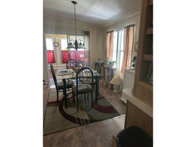 Spacious Corner Lot Gem: Furnished 2-Bedroom Palm Harbor Home on Schalamar Creek Golf and Country Club in Florida - for sale on GolfHomes.com, golf home, golf lot