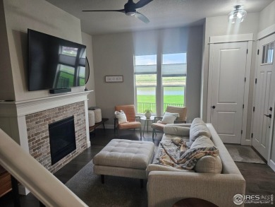 This beautiful 4 bed, 3.5 bath townhome offers lakefront living on Highland Meadows Golf Course in Colorado - for sale on GolfHomes.com, golf home, golf lot