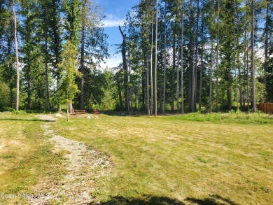 Charming 2-bedroom, 2-bath cottage nestled in a peaceful on Sandpoint Elks Golf Course in Idaho - for sale on GolfHomes.com, golf home, golf lot
