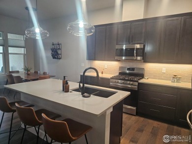 This beautiful 4 bed, 3.5 bath townhome offers lakefront living on Highland Meadows Golf Course in Colorado - for sale on GolfHomes.com, golf home, golf lot