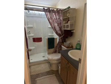 Spacious Corner Lot Gem: Furnished 2-Bedroom Palm Harbor Home on Schalamar Creek Golf and Country Club in Florida - for sale on GolfHomes.com, golf home, golf lot