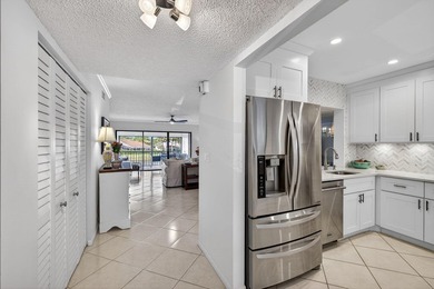 Beautifully updated 2-bedroom, 2-bath second-floor condo on Old Marsh Golf Club in Florida - for sale on GolfHomes.com, golf home, golf lot