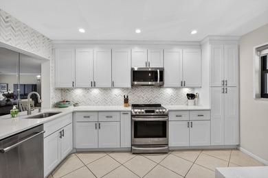 Beautifully updated 2-bedroom, 2-bath second-floor condo on Old Marsh Golf Club in Florida - for sale on GolfHomes.com, golf home, golf lot