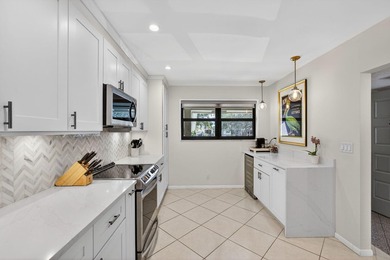 Beautifully updated 2-bedroom, 2-bath second-floor condo on Old Marsh Golf Club in Florida - for sale on GolfHomes.com, golf home, golf lot