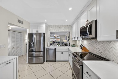 Beautifully updated 2-bedroom, 2-bath second-floor condo on Old Marsh Golf Club in Florida - for sale on GolfHomes.com, golf home, golf lot