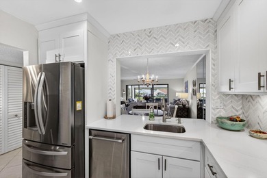 Beautifully updated 2-bedroom, 2-bath second-floor condo on Old Marsh Golf Club in Florida - for sale on GolfHomes.com, golf home, golf lot