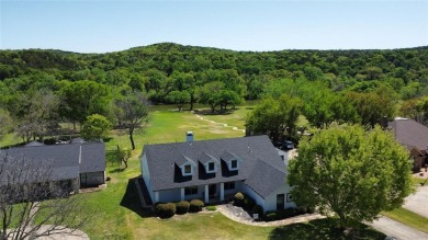 Immaculate riverfront home with a gradual slope yard to the on Pecan Plantation Country Club in Texas - for sale on GolfHomes.com, golf home, golf lot